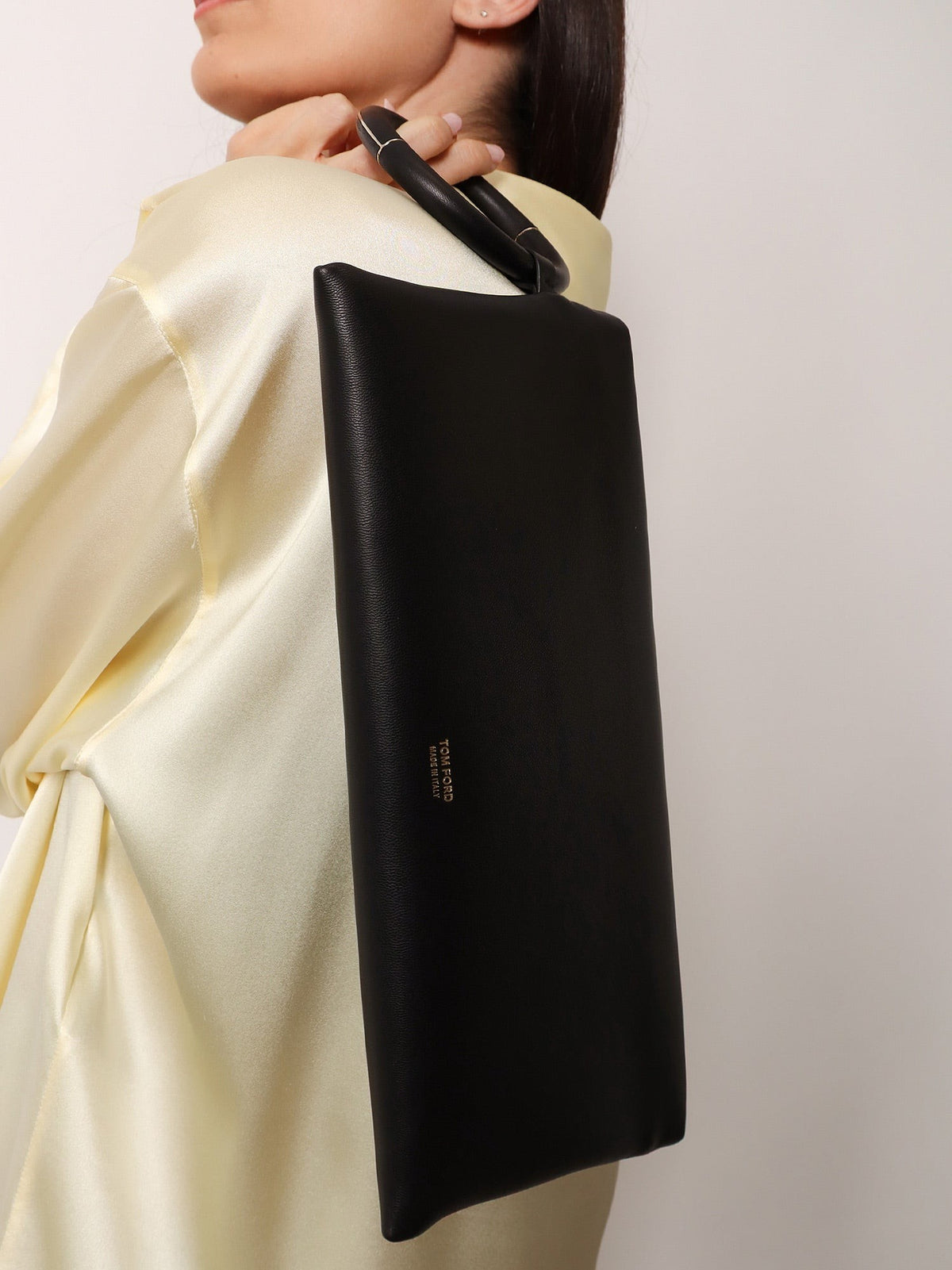 Aura leather clutch bag with lettering logo on the front 2