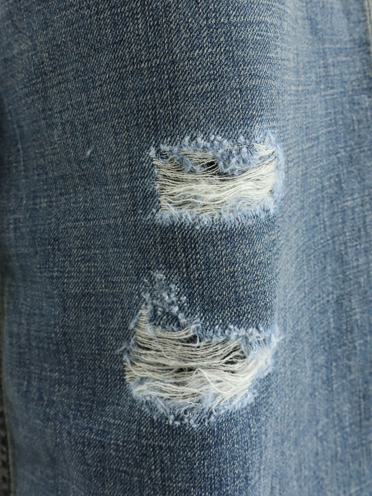 Destroyed-effect blue denim jeans 3